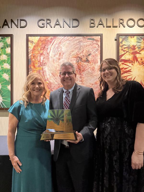 3 city staff members (Kathrine Blomquist, Scott Bouchie and Lauren Whittaker) with Crescordia Award 