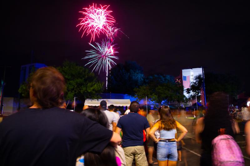 Crowd watching fireworks outside Mesa Convention Center at Arizona Celebration of Freedom