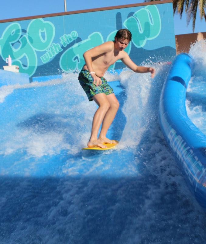 Surfer on FlowRider at Rhodes Aquatic Complex in Mesa 