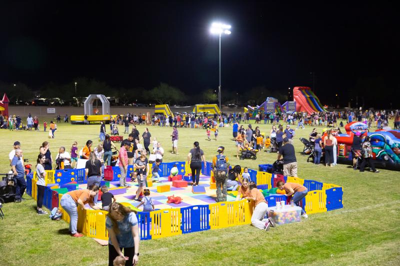 Kids and adults enjoying activities at Celebrate Mesa at Red Mountain Multi-Use Fields 
