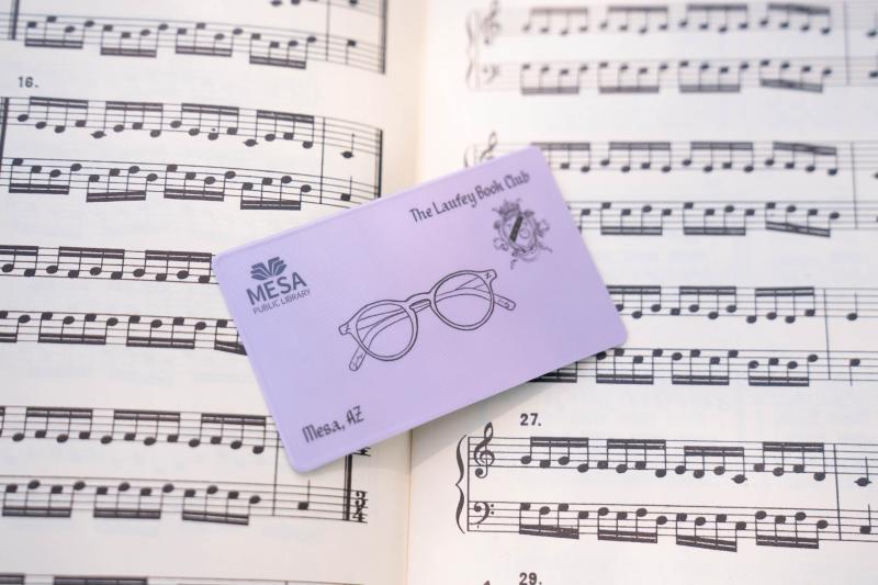 Photo of special-edition Laufey Book Club library card named for the singer and best-selling author