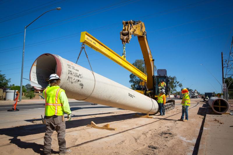 City employees working to install a section of pipe for the Central Mesa Reuse Pipeline 