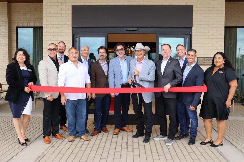 Photo of Mayor Freeman getting ready to cut the ribbon at new Tempo by Hilton/Homewood Suites 